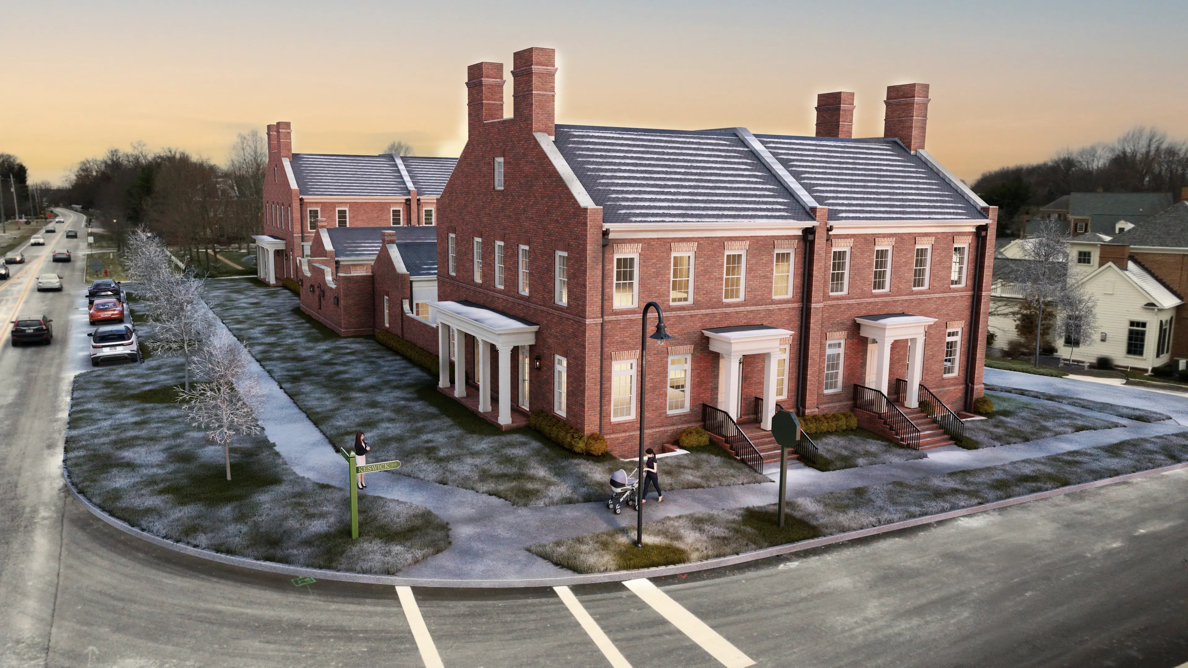 Richmond Square Grand Residences at dusk — six brick townhomes with lit windows at the corner of Main Street and Keswick Drive in New Albany, Ohio