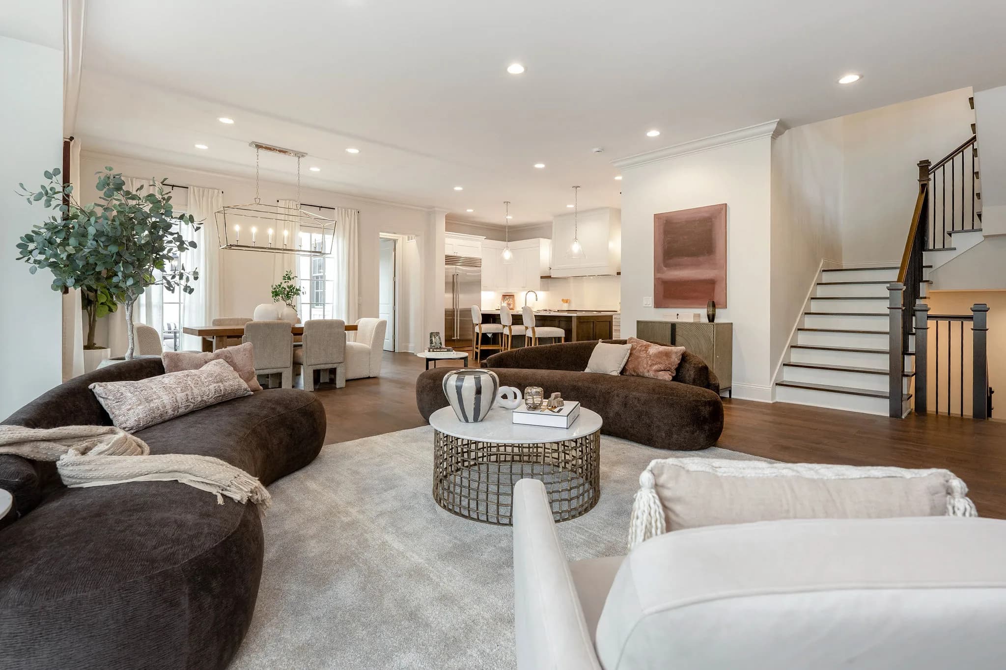 Living area toward the staircase and kitchen