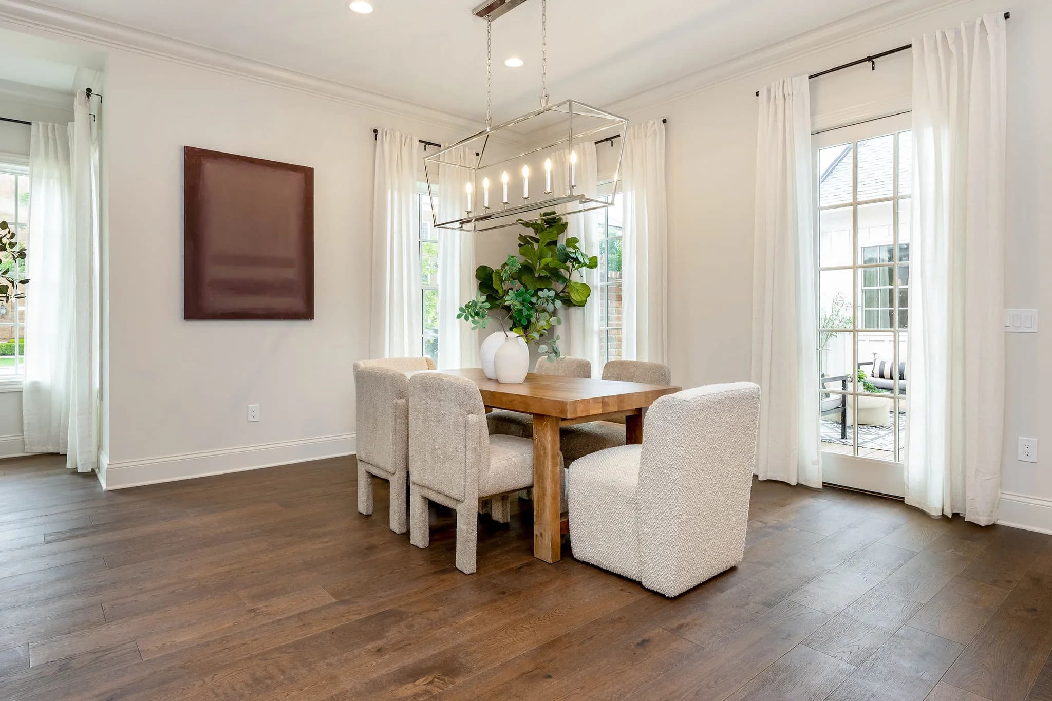 Dining nook under a linear chandelier