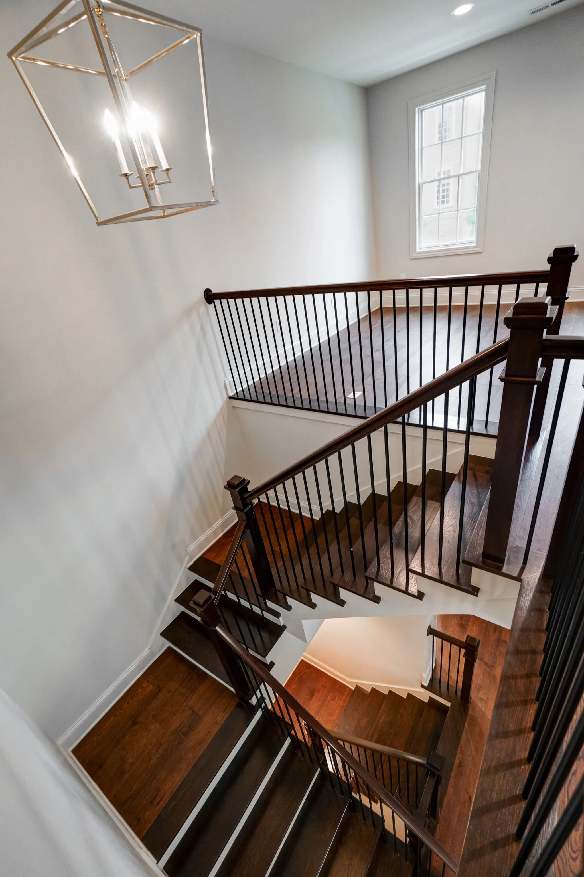 The staircase turning through three floors